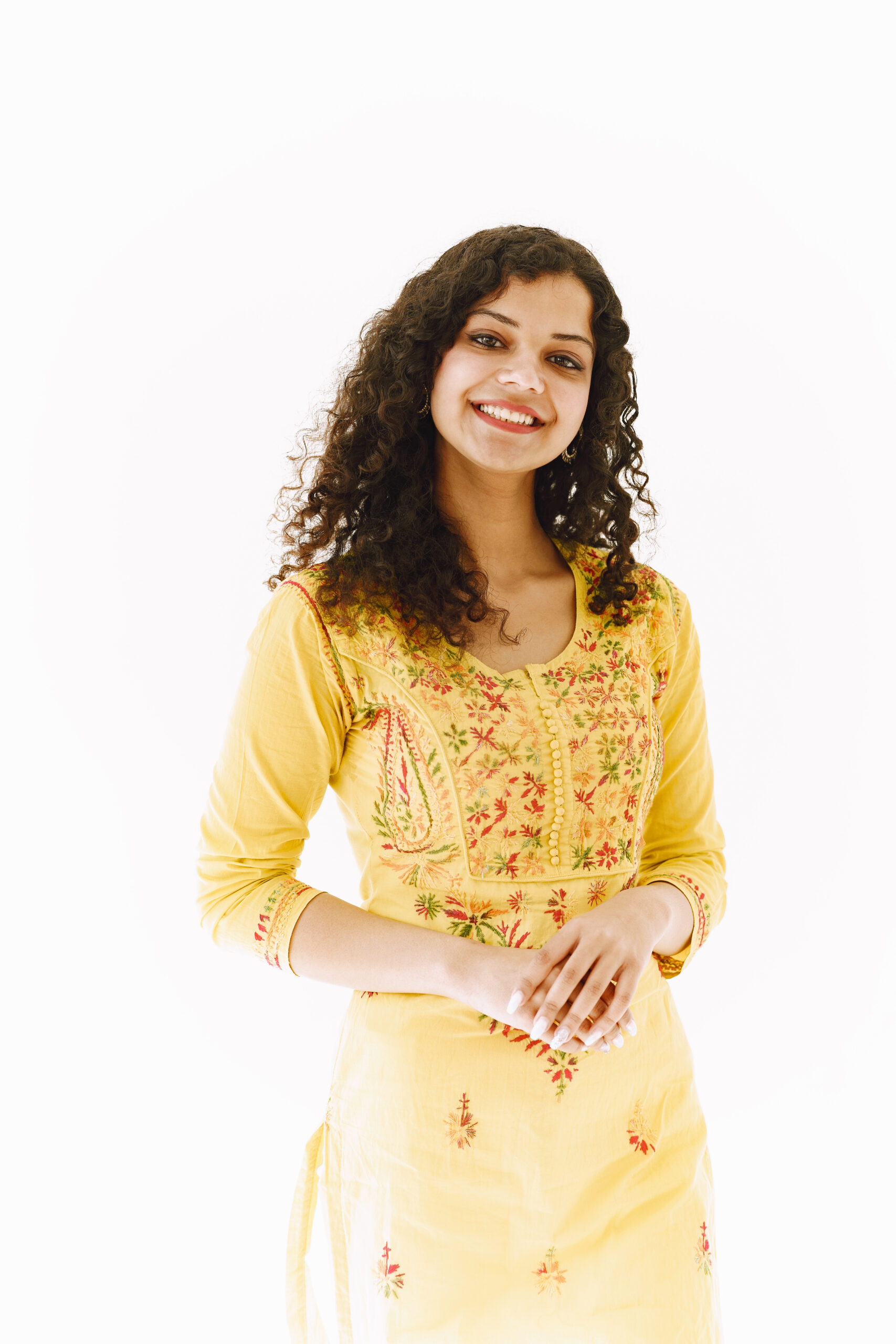 Beautiful portrait of young woman against white background